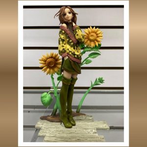 Figura PREIMUM Nana Komatsu Edición de Pie con Girasoles 23cm